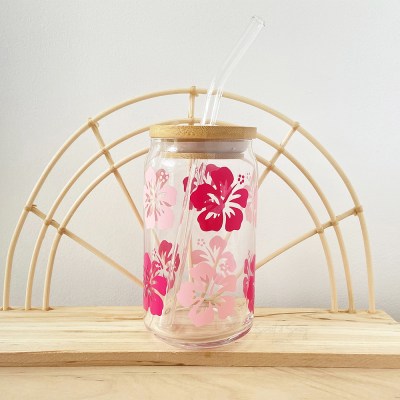 Glass hibiscus cup with hot pink and light pink hibiscus flowers