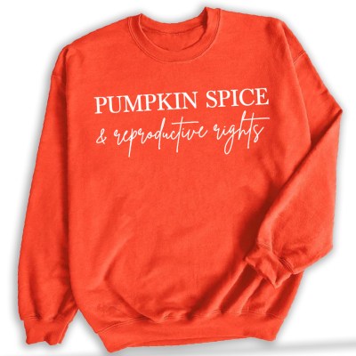 Orange sweatshirt with Pumpkin Spice and Reproductive Rights text in white on the front