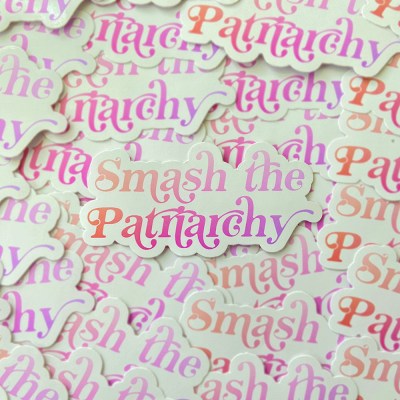Die cut sticker with decorative text "Smash the patriarchy" colored in pink gradient