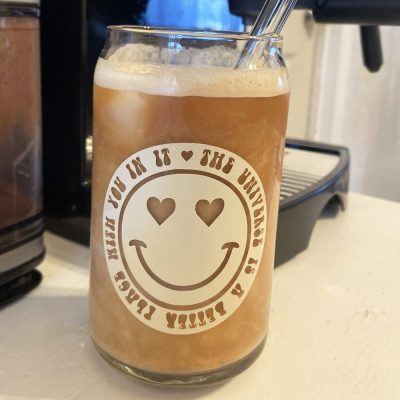 Glass can shaped cup with retro heart eyed smiley and The World Is A Better Place With You In It text